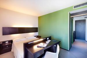 Postel nebo postele na pokoji v ubytování Hotel Lido