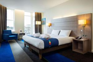 Säng eller sängar i ett rum på Park Inn by Radisson Palace