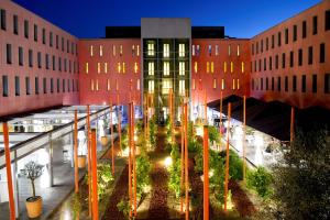 a view of a courtyard between two buildings at Radisson Blu Hotel Toulouse Airport in Blagnac