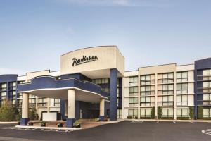 a building with aania sign on the front of it at Radisson Hotel Lenexa Overland Park in Lenexa