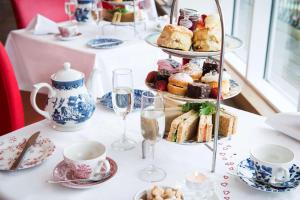 a white table topped with plates of food and drinks at Park Inn by Radisson Palace in Southend-on-Sea