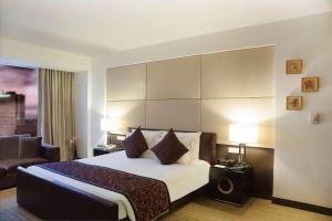 Säng eller sängar i ett rum på Radisson Blu Hotel Pune Kharadi