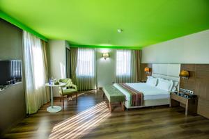 a hotel room with a bed and a table at Park Inn by Radisson Istanbul Asia Kavacik in Istanbul