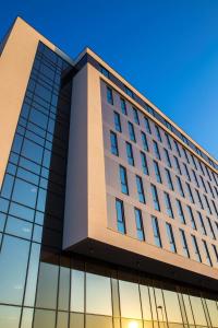 an office building with glass windows at Radisson Blu Hotel Oslo Alna in Oslo