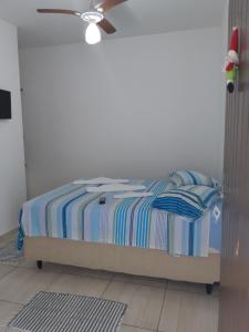 A bed or beds in a room at Pousada Raios de Luar