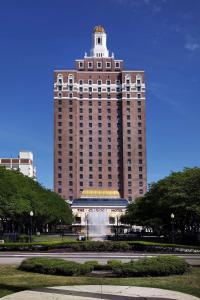 a large building with a fountain in front of it at The Claridge Hotel in Atlantic City