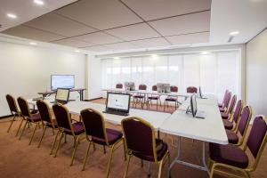 a conference room with a long table and chairs at GHL Style Barrancabermeja in Barrancabermeja +54 photos