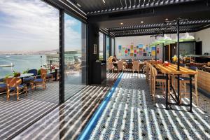 a restaurant with a view of the ocean at Park Inn by Radisson Izmir in İzmir