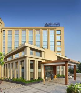 an office building with a large building at Radisson Blu Jammu in Jammu