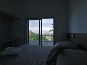 Ένα ή περισσότερα κρεβάτια σε δωμάτιο στο Bahia Caju Apartamentos +12 φωτογραφίες