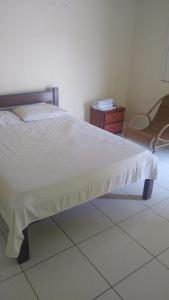 Säng eller sängar i ett rum på Pousada Potiguara