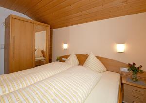 Postel nebo postele na pokoji v ubytování Rüf Wohlfühl-Apartments