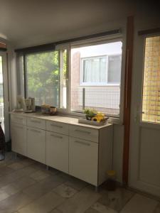 a kitchen with a sink and a window at Villa Anja in Kusadası