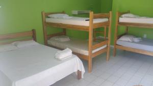 Våningssäng eller våningssängar i ett rum på Pousada Potiguara