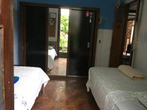 Кровать или кровати в номере Casa com natureza