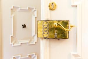 a door with a gold door knocker on it at Himmlisch Urlauben Söchau in Söchau