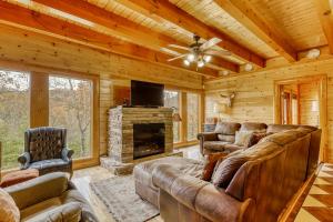 a living room with a couch and a fireplace at Bit O'Honey in Pigeon Forge