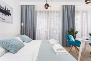 Ένα ή περισσότερα κρεβάτια σε δωμάτιο στο City of the Kings - Smile Apartment