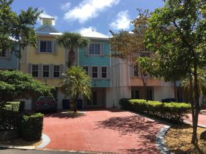 a large house with palm trees in front of it at LIC Mgr - MODERN 3 BED 4 BATH VILLA - UPSCALE OCEANFRONT RESORT - INDOOR PICKLEBALL - SPEAKEASY! in Key Largo