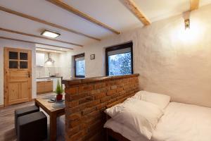 Posteľ alebo postele v izbe v ubytovaní ARAMIKA apartamenty