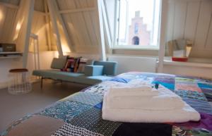 a bedroom with a bed with two towels on it at BB88 in Leeuwarden