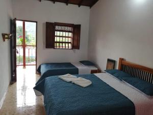 Postel nebo postele na pokoji v ubytování Hotel Dulce Campestre