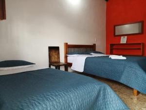 Postel nebo postele na pokoji v ubytování Hotel Dulce Campestre