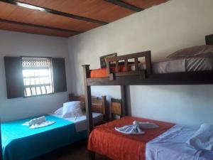 Postel nebo postele na pokoji v ubytování Hotel Dulce Campestre