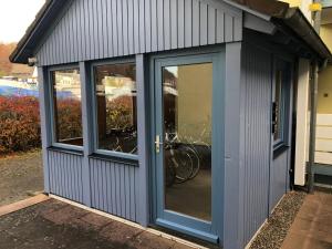 a garage with a door with a bike in it at Fewo Seeresidenz auf Scheid in Waldeck