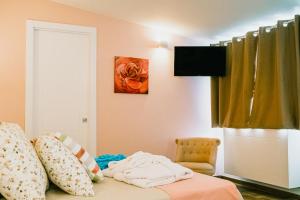 TV a/nebo společenská místnost v ubytování Una Perla Nel Verde