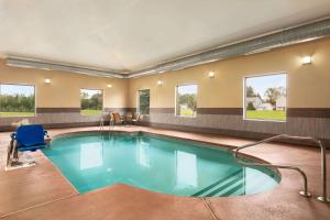 a large pool in a hotel room with at La Quinta by Wyndham Lackawanna in Lackawanna