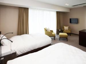 Postel nebo postele na pokoji v ubytování Auberge de South Terrace