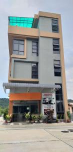 a building with a store in front of it at Coconut Bay Lodge in Bandar Seri Begawan