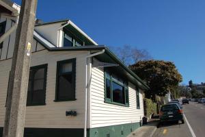 a house on the side of a street at Shakespeare Cottage in Napier