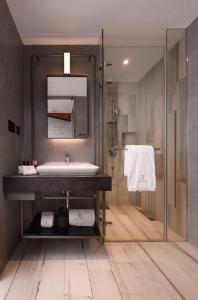 a bathroom with a sink and a shower at Brio Hotel in Kaohsiung