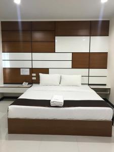 Postel nebo postele na pokoji v ubytování TTT Hotel