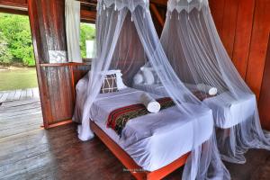 Letto o letti in una camera di Hamueco Dive Resort Raja Ampat