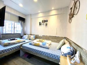 Una cama o camas en una habitación de Hong Kong Hostel (Tsim Sha Tsui Mansion)