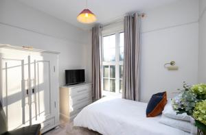 Pages Hotel and Guesthouse客房内的一张或多张床位