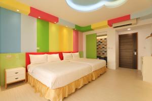 Ein Bett oder Betten in einem Zimmer der Unterkunft Shi Guang Sea View