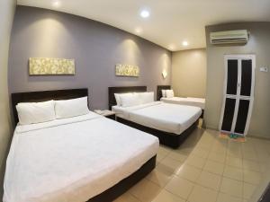 Krevet ili kreveti u jedinici u objektu JV Hotel @ Bandar Tasek Mutiara