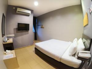 TV a/nebo společenská místnost v ubytování JV Hotel @ Bandar Tasek Mutiara
