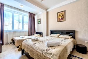 Postel nebo postele na pokoji v ubytování 2-room Apartment NFT Gudauri Penta 503 + 31 fotografií