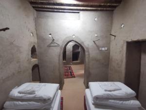 Letto o letti in una camera di Bait Aljabal Hospitality Inn