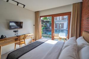 Una cama o camas en una habitación de Kubu Tropis