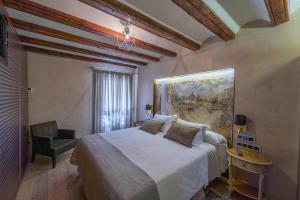 Postel nebo postele na pokoji v ubytování El Palacio de Argensola by Alogest