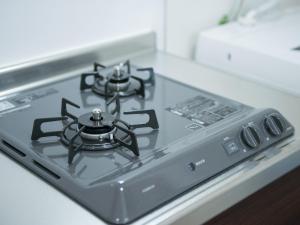a stove top oven sitting on top of a counter at Maruka石垣島 in Ishigaki Island +16 photos
