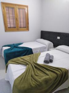 A bed or beds in a room at TABLERO 403, ENCANTADOR Apto 8 pax cerca PLAYA DEL INGLES