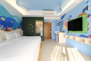 Ein Bett oder Betten in einem Zimmer der Unterkunft Shi Guang Sea View
