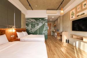Ein Bett oder Betten in einem Zimmer der Unterkunft Shi Guang Sea View